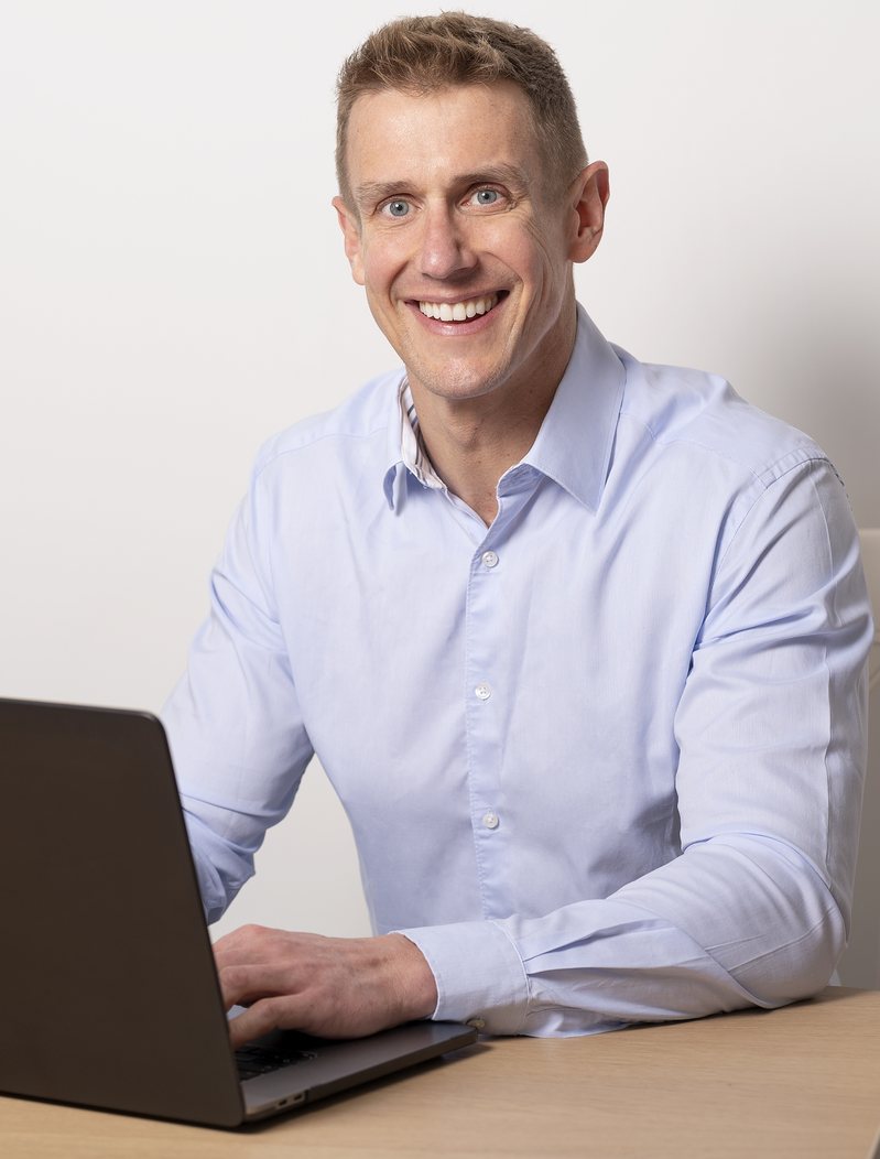 Dr Adam Abbs at his desk
